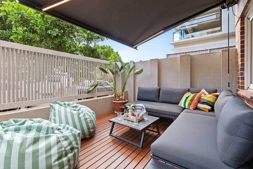 Relax after a day at the beach
Private outdoor terrace with lounge seating at apartment in Bondi