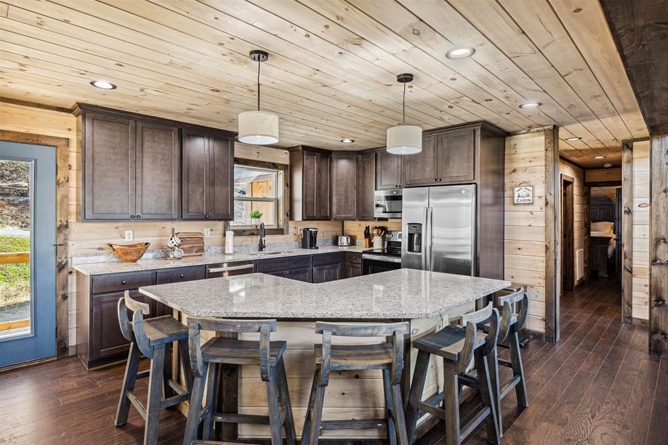 Kitchen featuring a large island and modern appliances.
