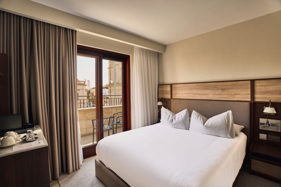 Deluxe Double Room, Balcony | Minibar, in-room safe, desk, blackout drapes