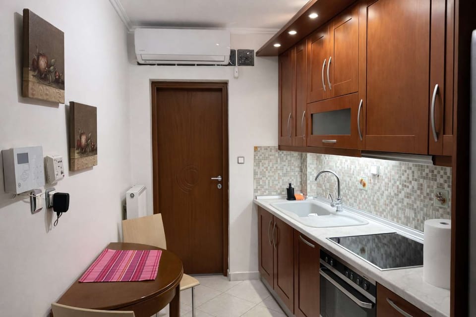 Kitchen Overview from the Entrance
Functional kitchen layout with ample cabinet storage and countertop space.