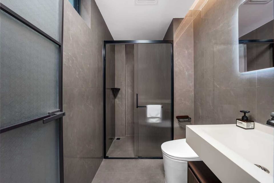 Shower, hair dryer, slippers, towels