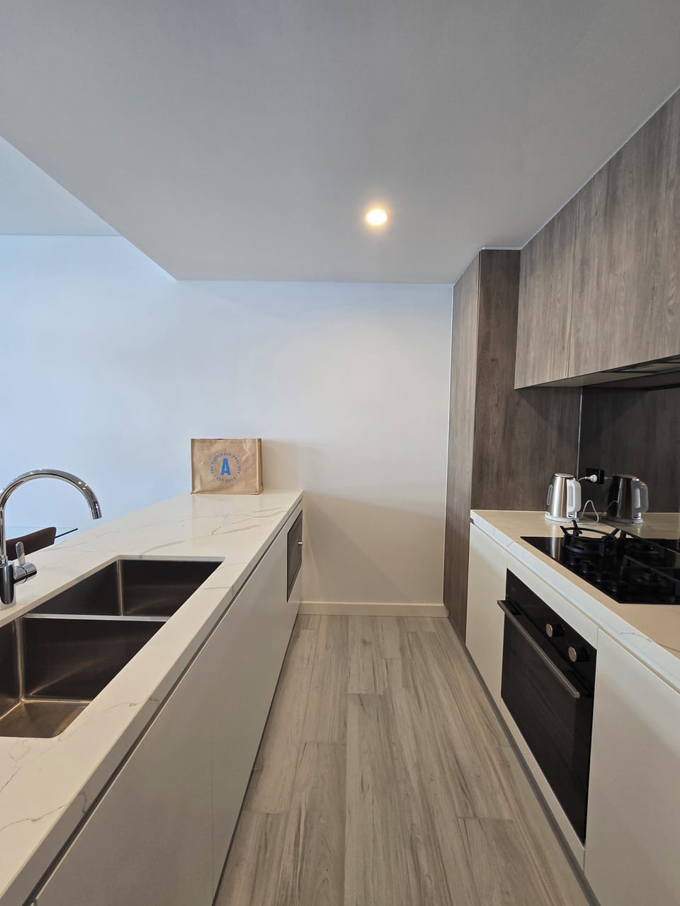 Fully equipped modern kitchen with stove, oven, microwave, dishwasher