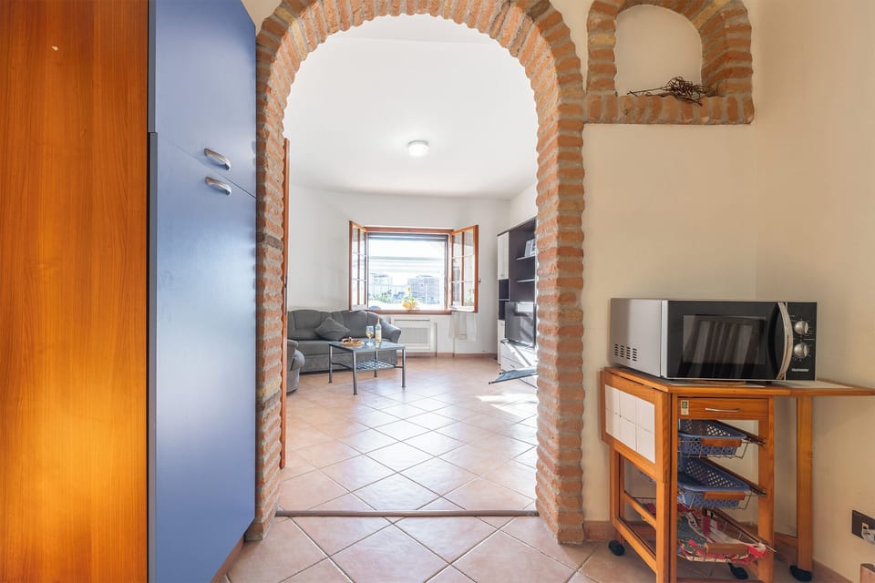 Apartment, Patio, City View | Living area | Flat-screen TV