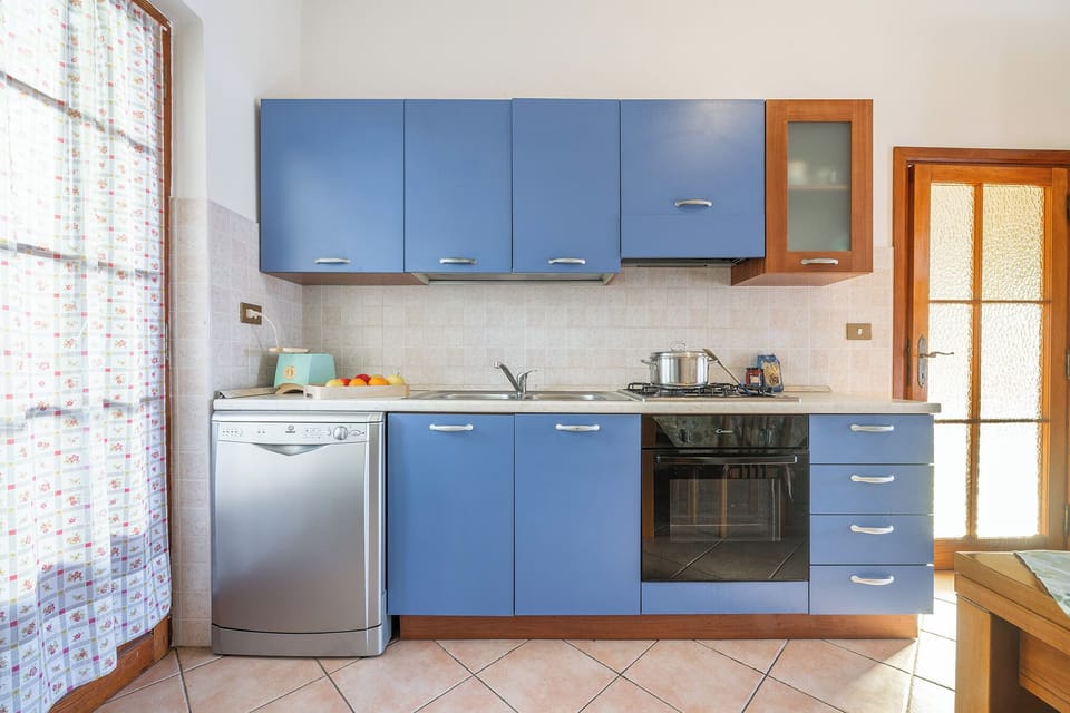 Apartment, Patio, City View | Private kitchen | Full-size fridge, microwave, stovetop, dishwasher