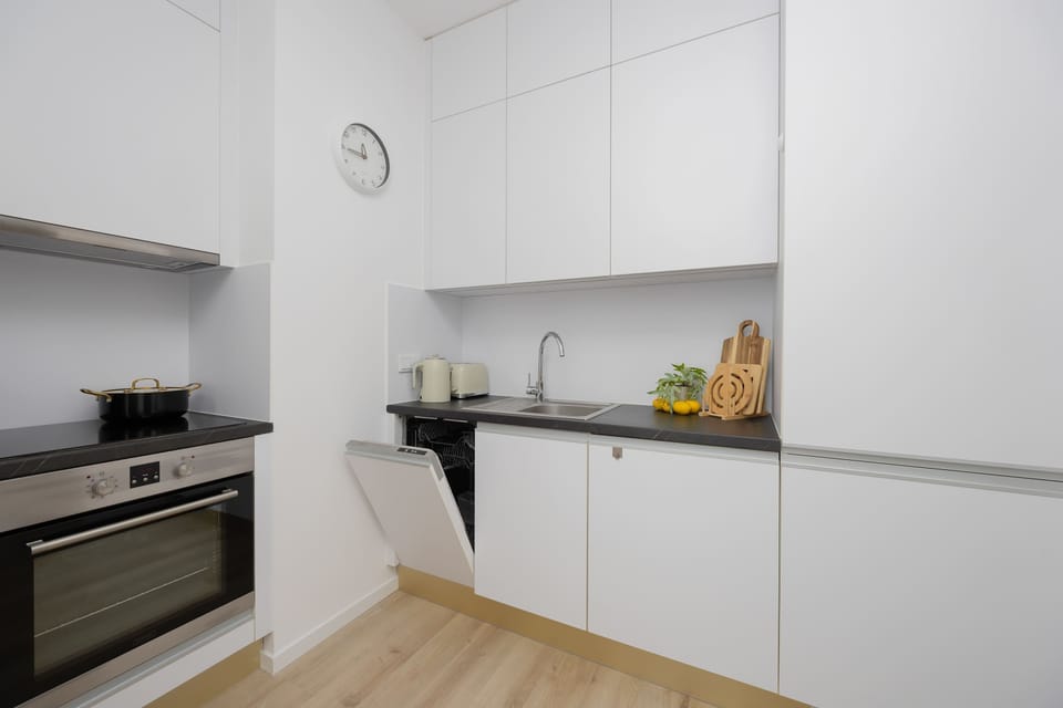 A view of the fully equipped kitchen highlights a functional space designed for longer stays.