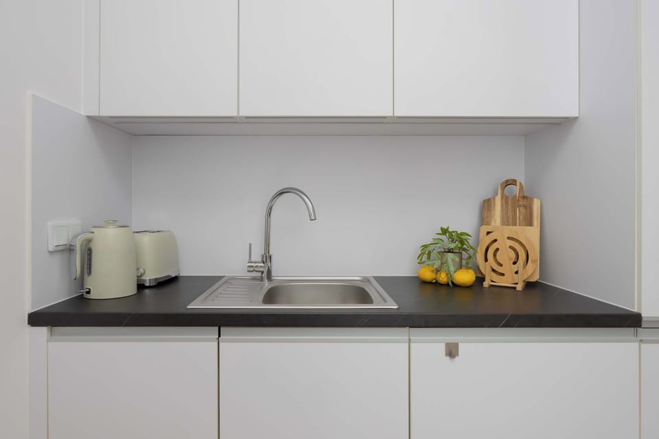 A clean, elegant kitchen setup with a clearly defined work area makes cooking easy and comfortable.
