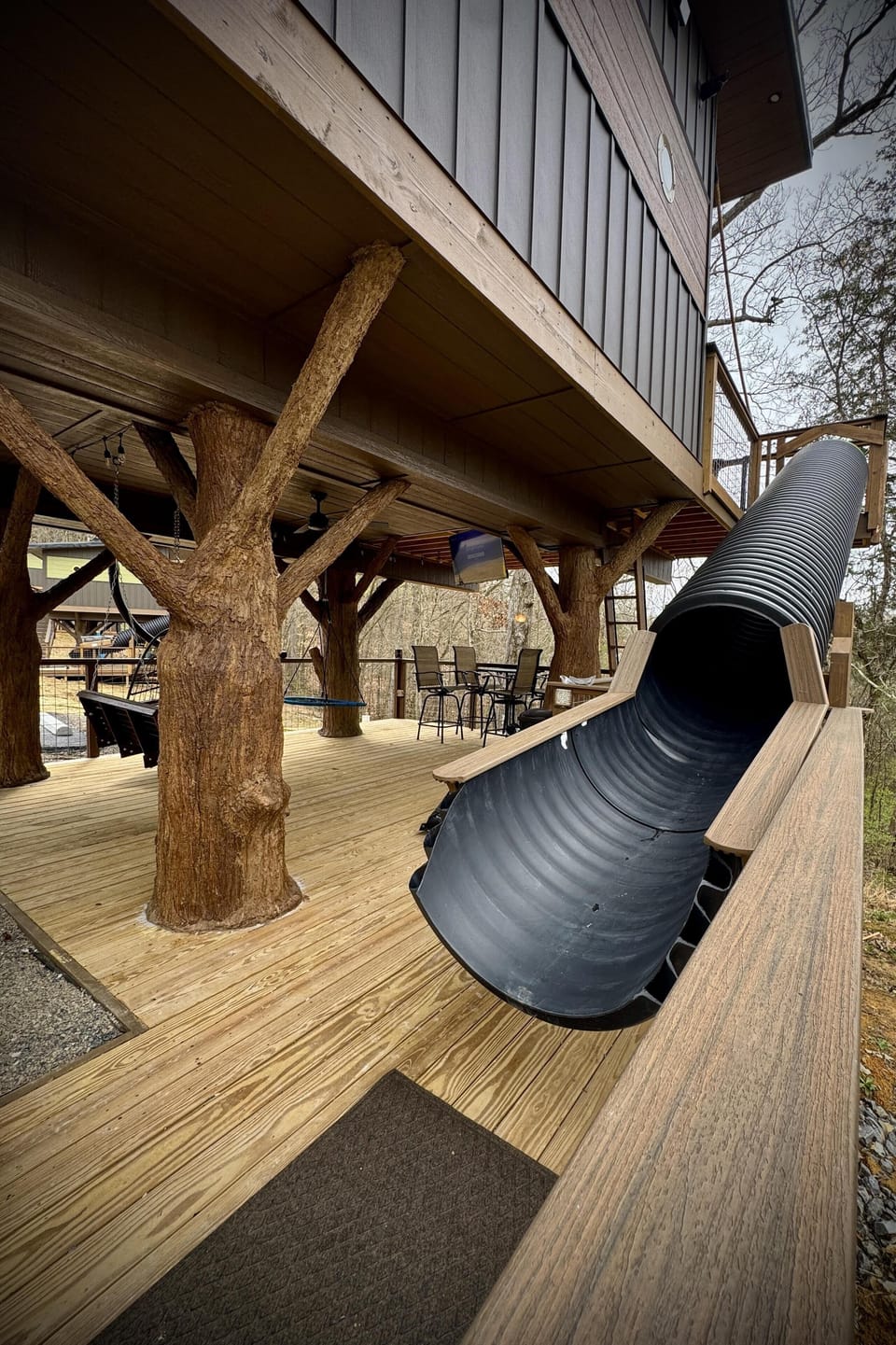 LOWER DECK - 20-FOOT SLIDE AT DON'T STOP BE-LEAFING TREEHOUSE - SANCTUARY TREEHOUSE RESORT