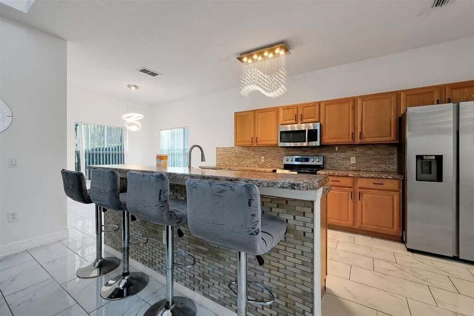 Kitchen bar perfect for enjoying meals and drinks together.