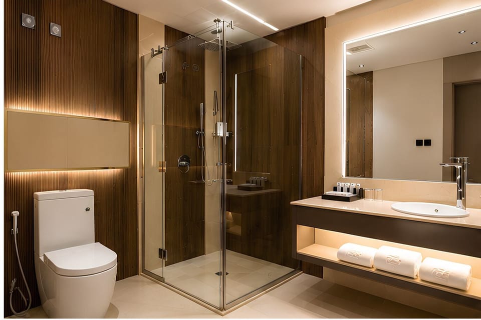 Shower, hair dryer, slippers, towels