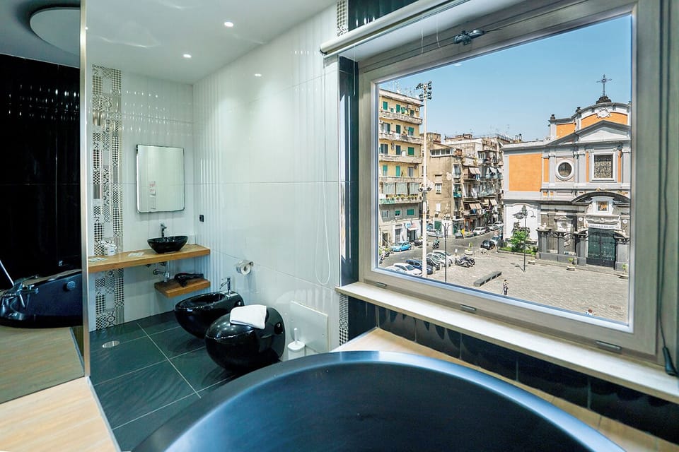 Exclusive Studio Suite, Hot Tub, Annex Building (P.zza Mercato 45) | Bathroom | Free toiletries, hair dryer, bidet, towels