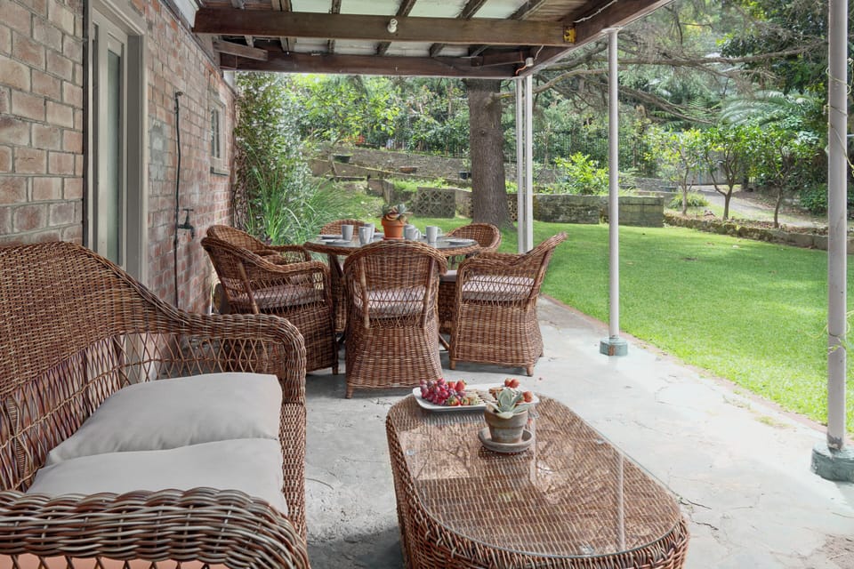 A second patio offers relaxed seating and a second alfresco dining area overlooking the leafy surrounds.