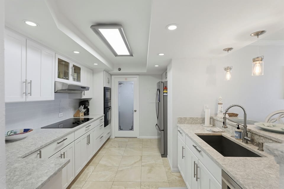 Fully equipped and modern designed, the kitchen features modern appliances and ample counter space—making meal prep easy whether you’re brewing morning coffee or cooking up fresh local seafood.