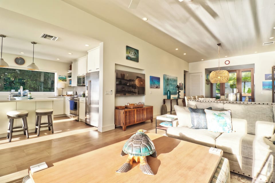 Light-filled living room featuring an open floor plan and beautiful views!