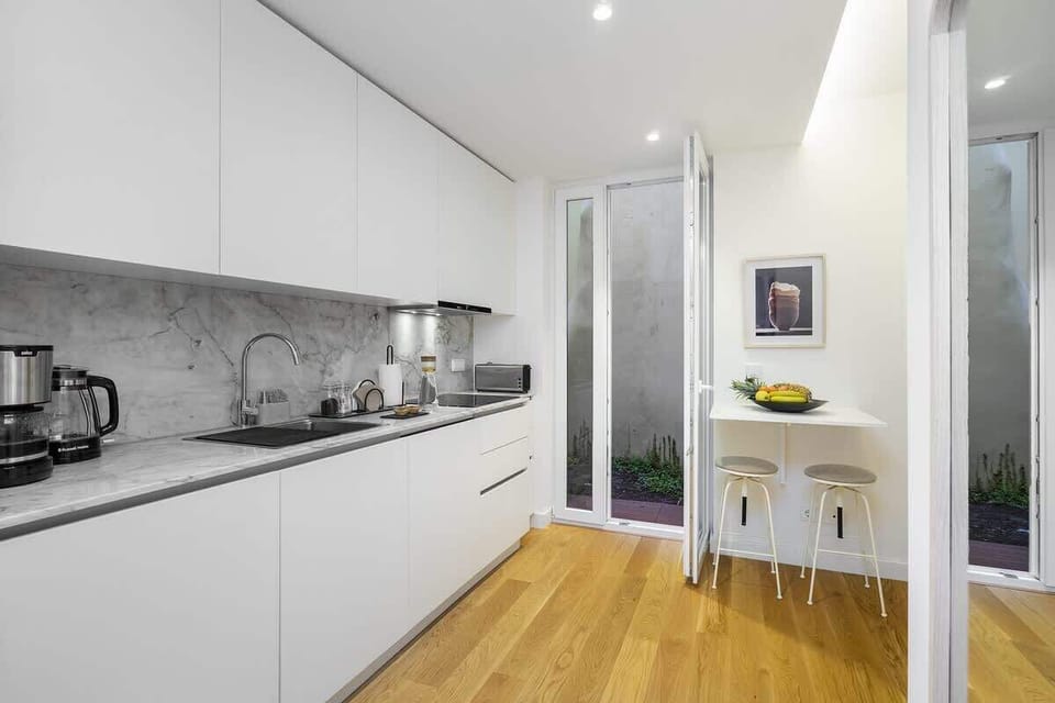Kitchen to garden access. The patio is completely private. 
The door has mosquito nette for bug protection. 
