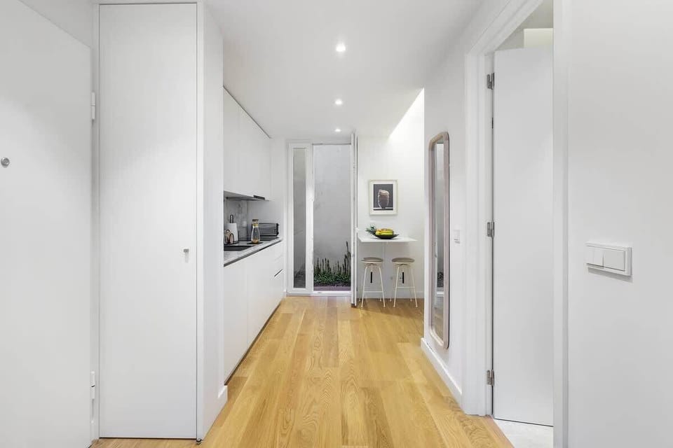 The kitchen opens to the patio of the apartment. 
There are stools to and a high table to enjoy your food. 
The garden door also has nette for bug-free life 