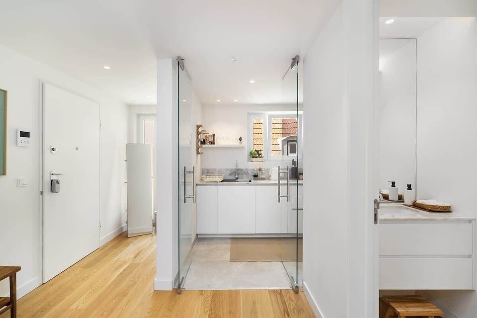 The entrance of the unit has plenty of space including a big mirror and hanger/cabinet. It is separated with the kitchen and social bathroom of the unit. 