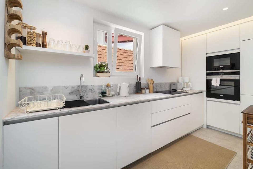 The kitchen has stainless steel SIEMENS appliances, a spacious countertop. It has everything that you need for cooking and entertaining.