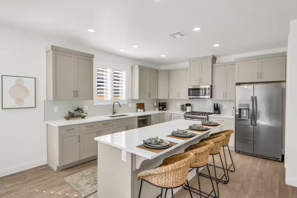 Whip up your favorite dishes in this sleek, chef-inspired kitchen with modern appliances.