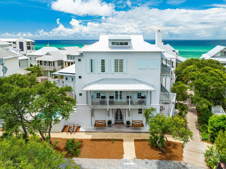 Beautiful coastal home with turquoise ocean views and pristine beach access in a charming seaside community.
