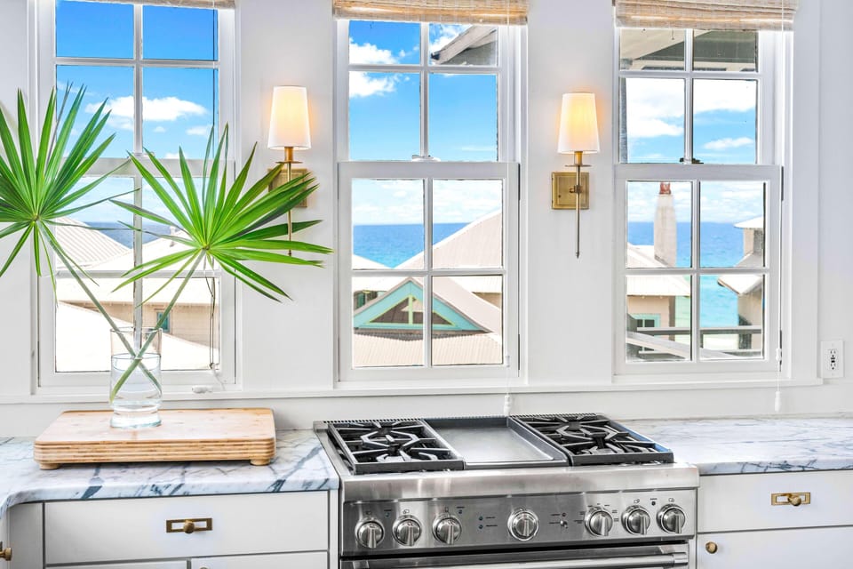 Your chef-worthy kitchen features stunning sea views while you cook, with professional appliances and elegant marble countertops creating the perfect culinary retreat.