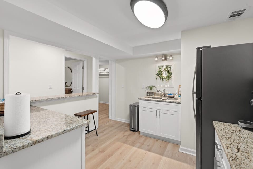 Modern kitchen space with full-size appliances, ample counter space, and convenient access to the living and dining areas.