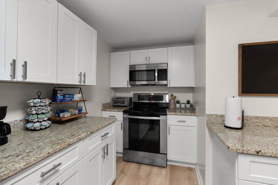 Modern kitchen space with full-size appliances, ample counter space, and convenient access to the living and dining areas.