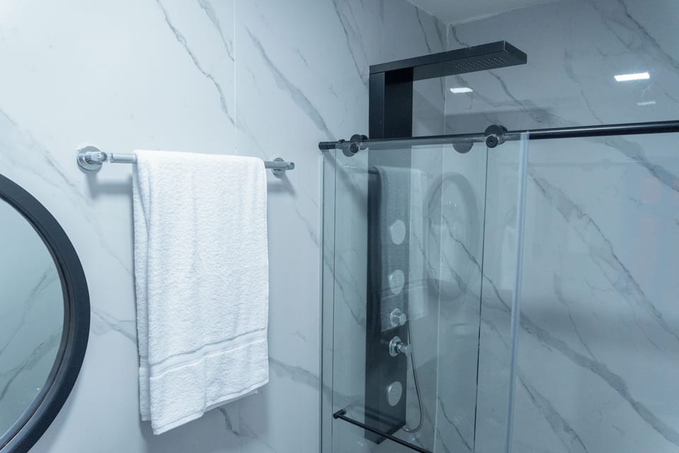Presidential Suite, Balcony, Pool View | Bathroom | Shower, rainfall showerhead, towels, soap