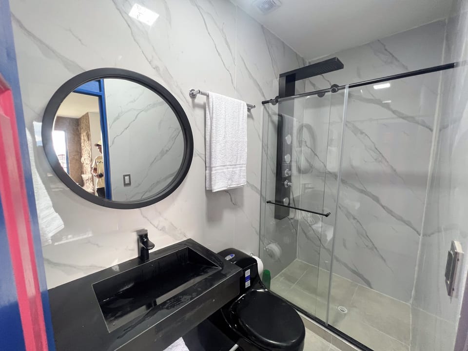 Presidential Suite, Balcony, Pool View | Bathroom | Shower, rainfall showerhead, towels, soap