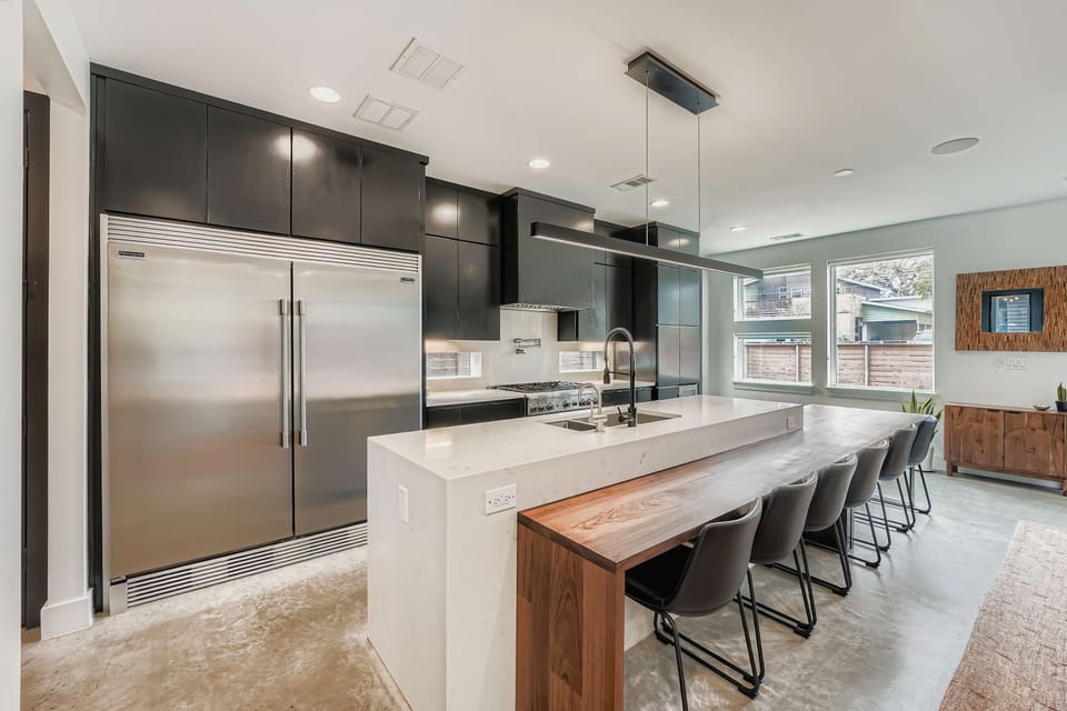 Fully equipped kitchen with stainless appliances.
