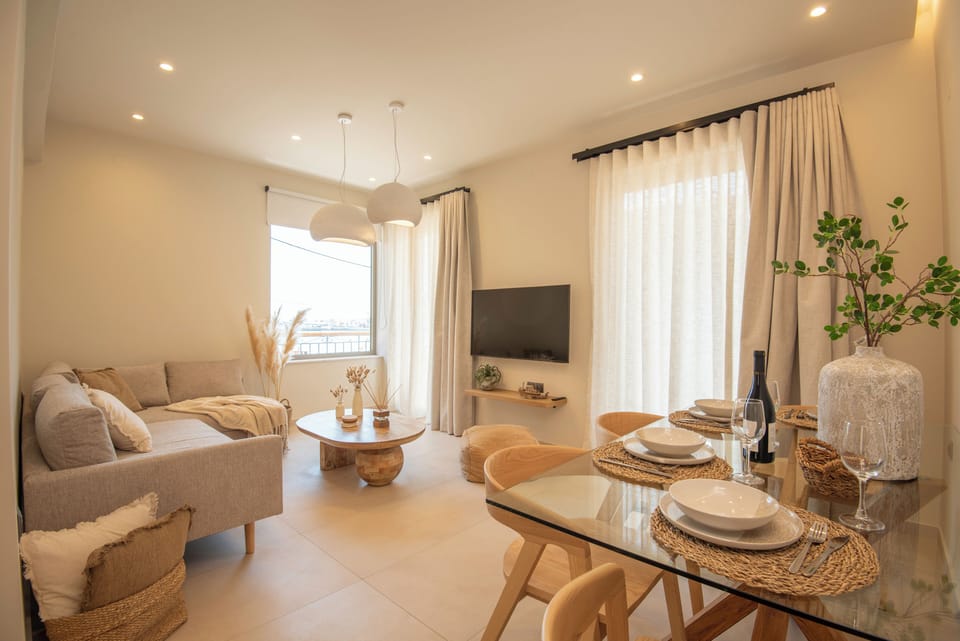 Bright & airy open-plan living and dining area, blending comfort and character.
