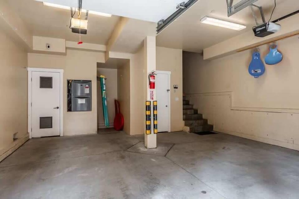 Secure, private 2-car garage with internal access, storage space, and automatic openers.