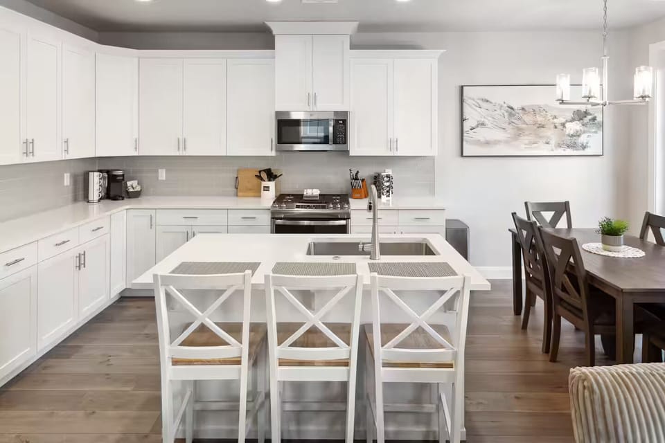 Chef’s dream kitchen, complete with stainless steel appliances and a breakfast bar.