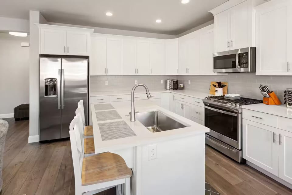 Kitchen island bar seating for 3 with room to prepare and enjoy meals together.