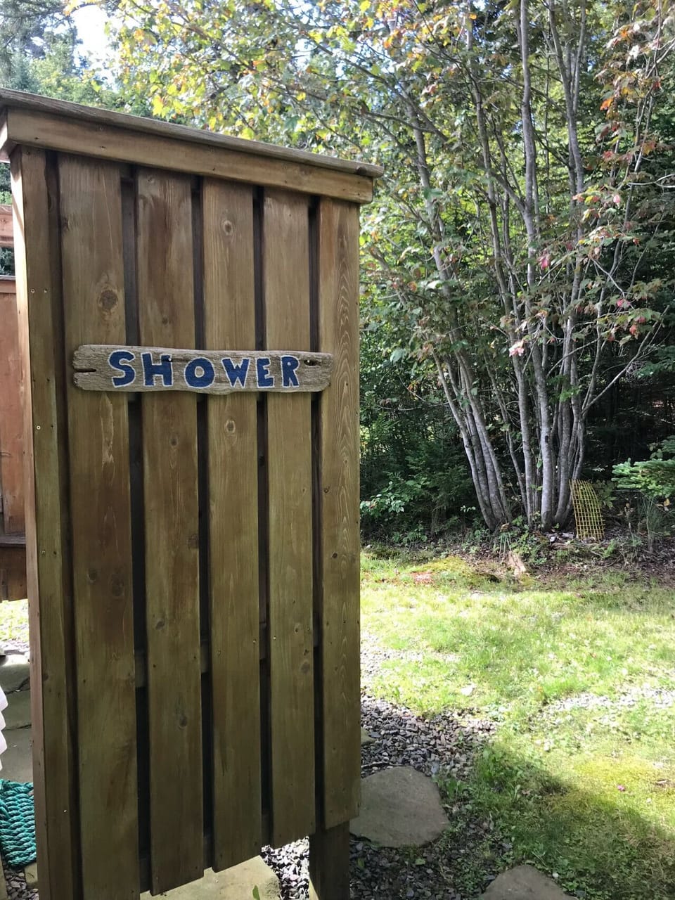 An outdoor shower for guest use that`s perfect after a summer dip!