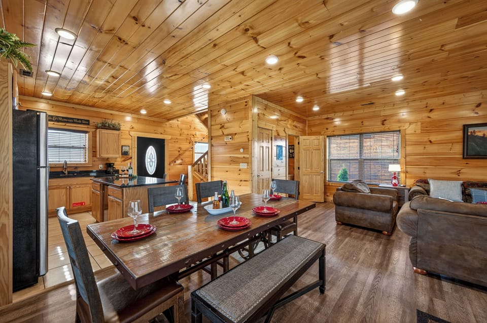 Enjoy effortless entertaining in our open-concept living area. A charming dining table is situated steps away from the fully-equipped kitchen and guest powder room