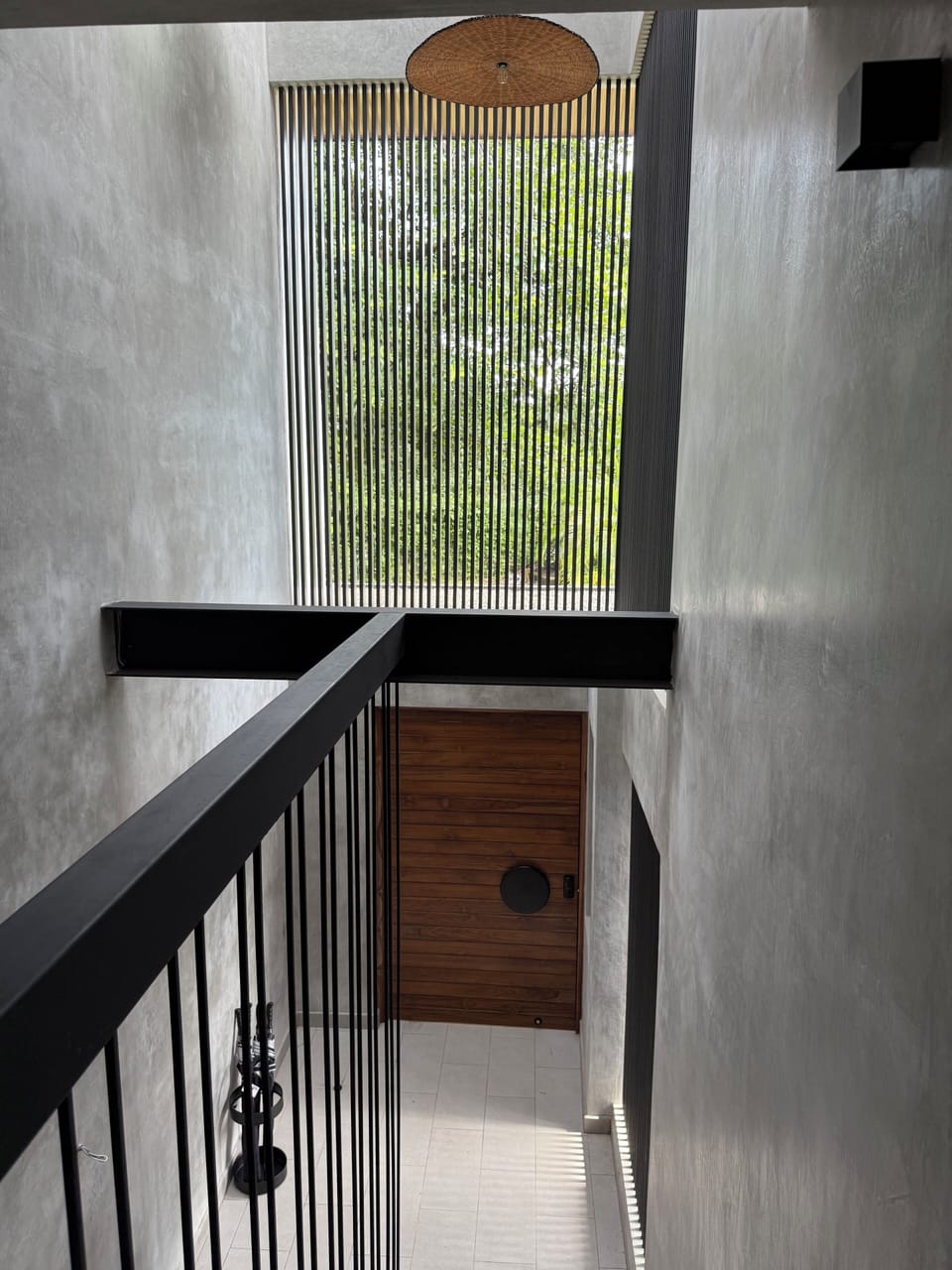 View looking down from 2nd floor landing to front door