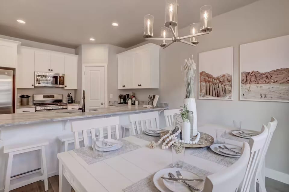 Cook, dine, and unwind in this airy, open kitchen and dining space designed for comfort and connection.