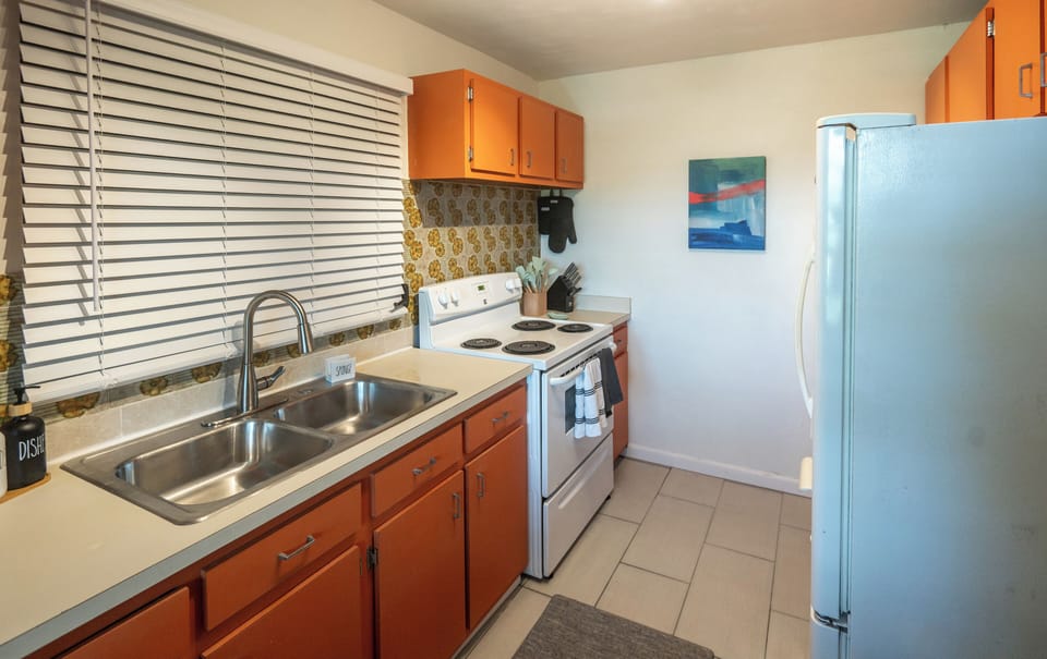 Kitchen with retro orange cabinets! 
