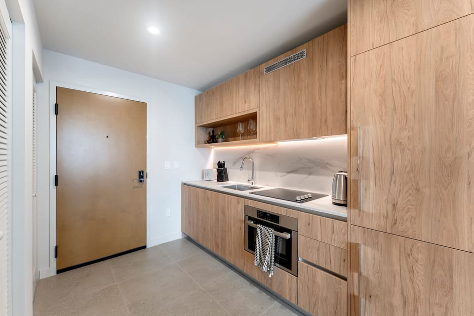 Sleek kitchen with quartz countertops and cabinetry