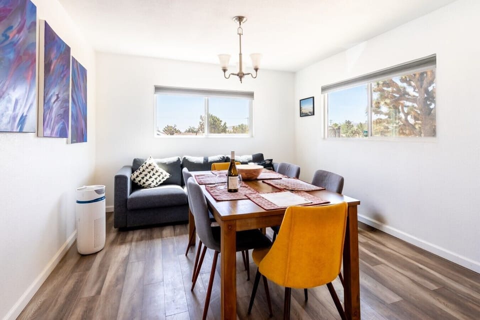 Dining Area | Wood Dining Table | Sectional Sofa & Desert Views