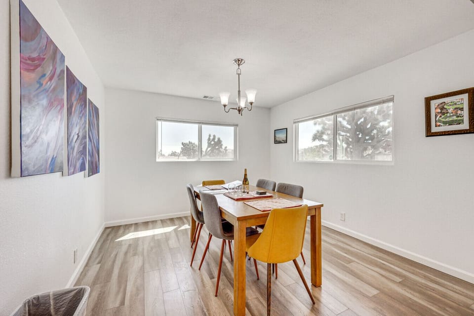 Dining Area | Table Seating | Chandelier Lighting & Window Exposure