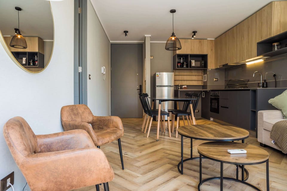 Stylish studio with a cozy living area and modern kitchen, perfect for a comfortable stay.