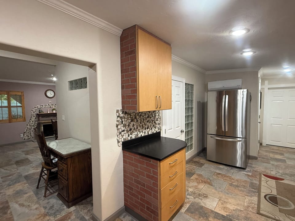 Desk, refrigerator in kitchen