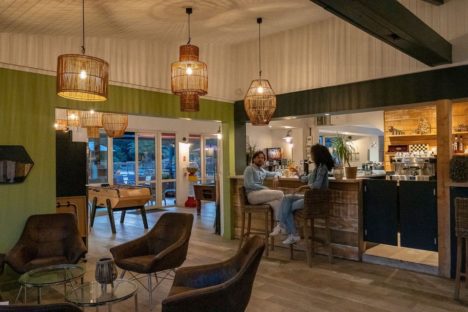 Step into a stylish lounge area with inviting decor and comfortable seating, perfect for unwinding or catching up with friends.