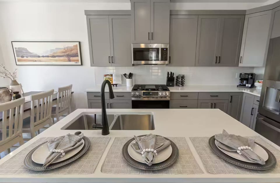 Fully Stocked Gourmet Kitchen featuring seating at the bar
