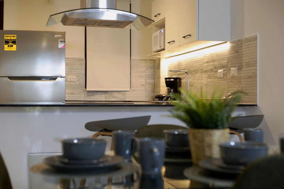 Exclusive Apartment | Private kitchen | Full-size fridge, microwave, coffee/tea maker, cookware/dishes/utensils