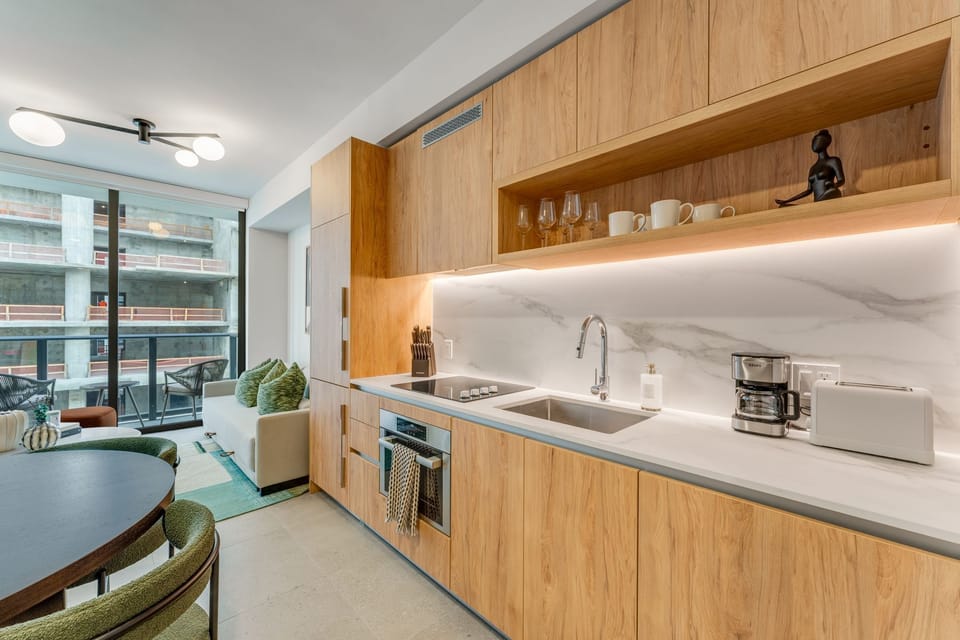 Sleek kitchen + dining space designed for effortless meals