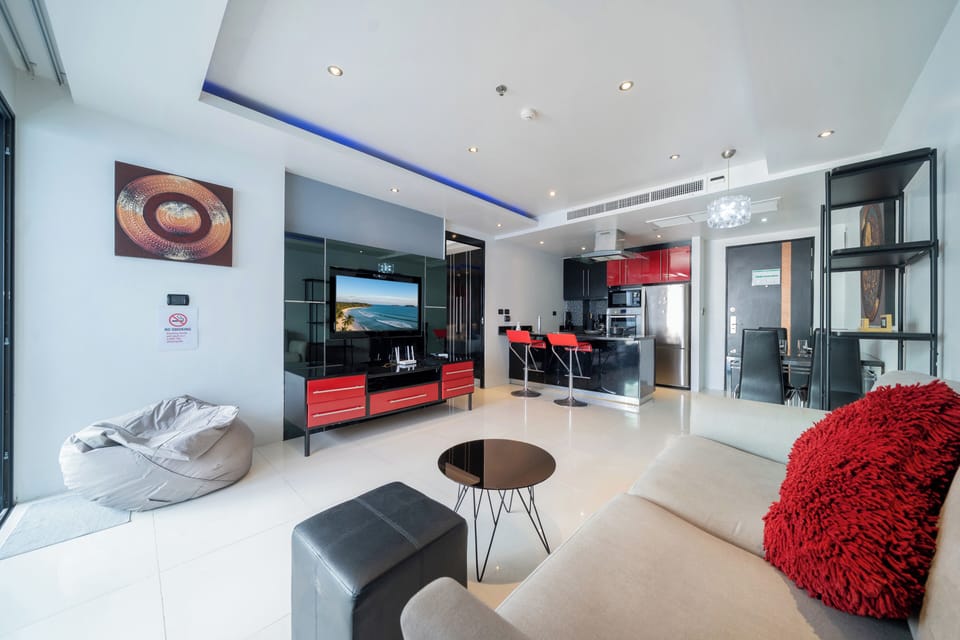 Deluxe Apartment, 1 Bedroom, Balcony, City View (Absolutely Amazing Bangla 1BR Suite) | Living area | 55-inch Smart TV with digital channels