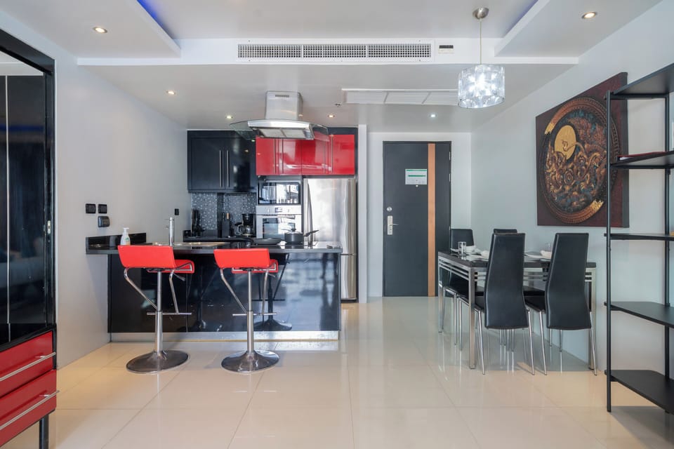 Deluxe Apartment, 1 Bedroom, Balcony, City View (Absolutely Amazing Bangla 1BR Suite) | Living area | 55-inch Smart TV with digital channels