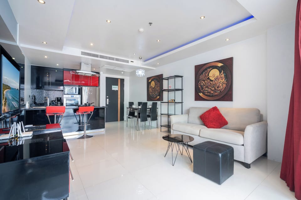 Deluxe Apartment, 1 Bedroom, Balcony, City View (Absolutely Amazing Bangla 1BR Suite) | Living area | 55-inch Smart TV with digital channels